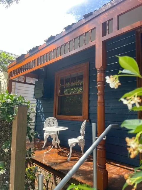 Finished timber verandah and blue weatherboards at the Camp Cove project, Watsons Bay
