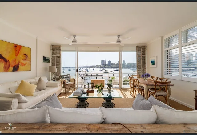 Finished living room with harbour views at the Billyard Avenue apartment, Elizabeth Bay