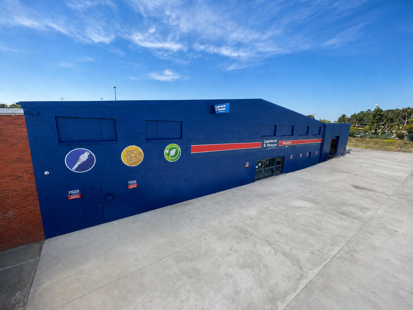 L&H Electrical Fyshwick — repainted branch exterior in L&H corporate blue