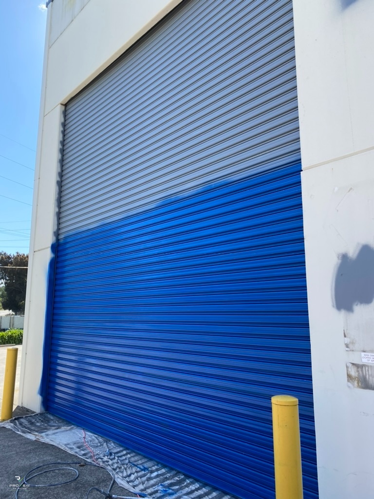 During — roller door being painted