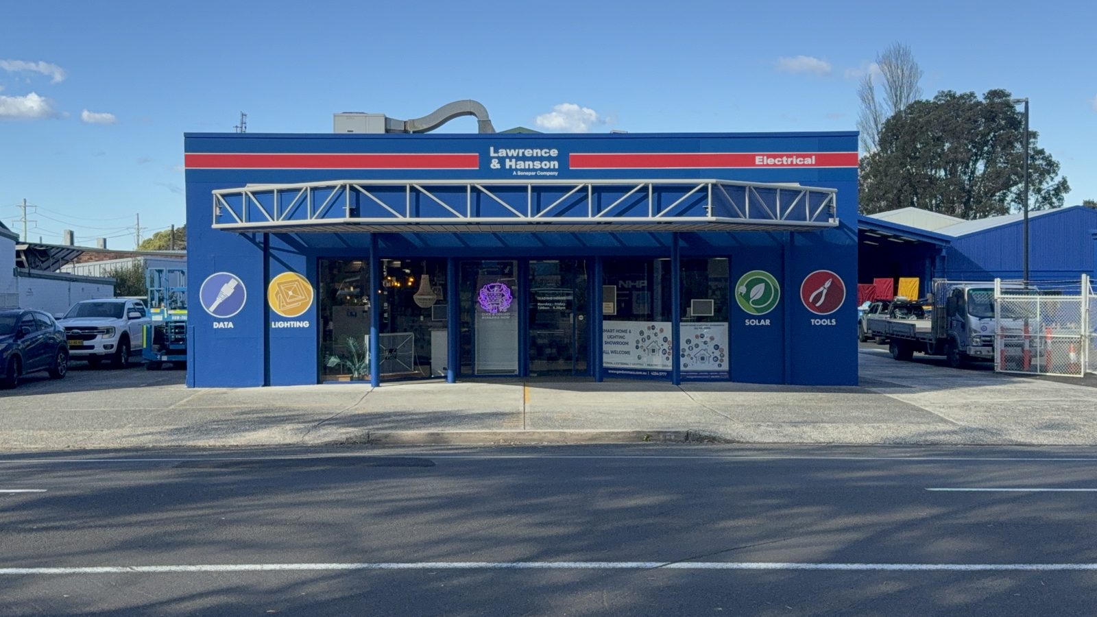 After — the same frontage repainted in L&H Electrical colours