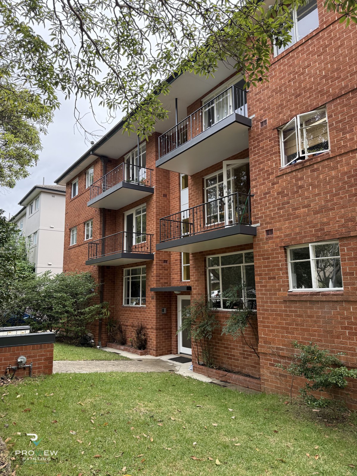 Repainted balcony railings, fascias and soffits