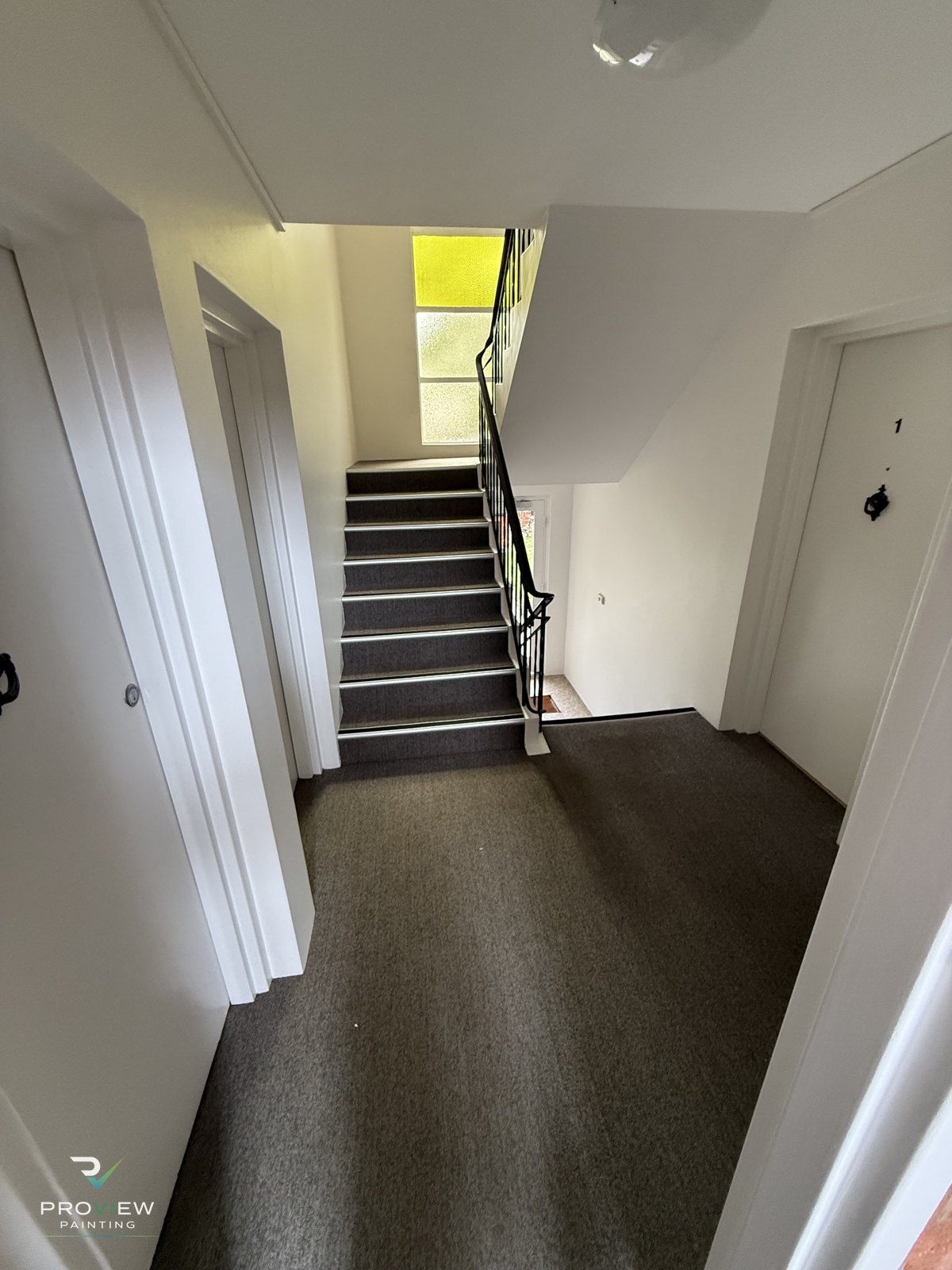 Repainted common-area entry hall and stairs