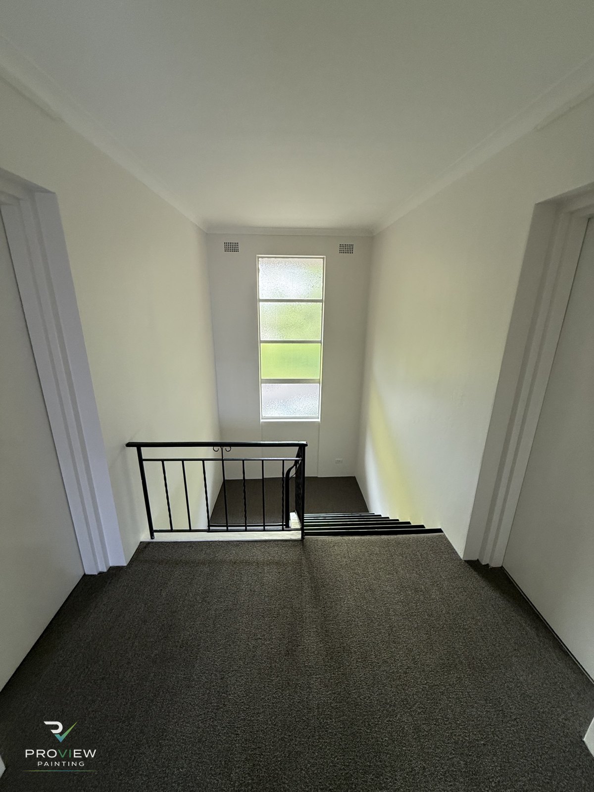 Repainted common-area landing and stairwell