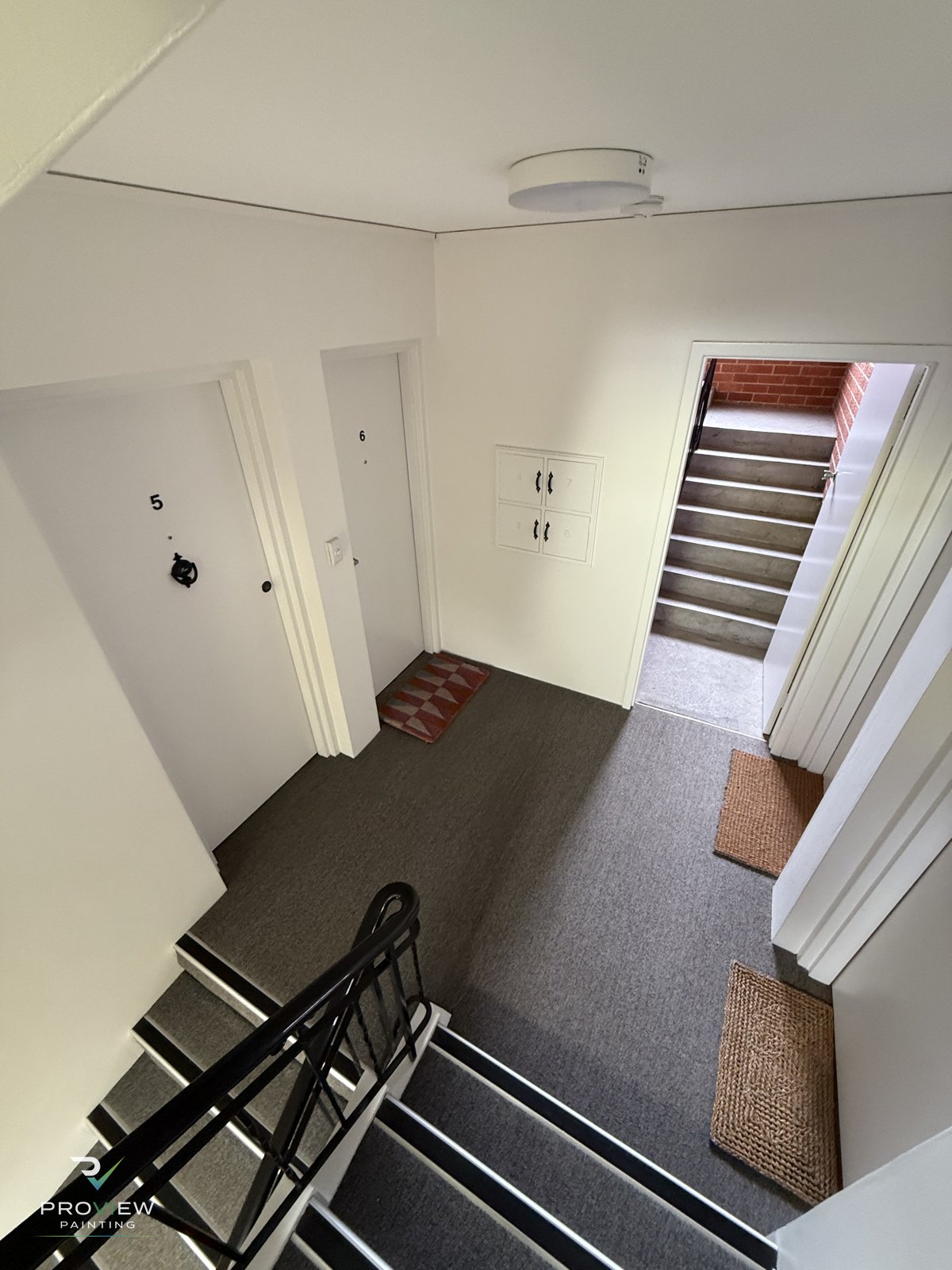 Repainted stairwell, unit doors and common-area walls